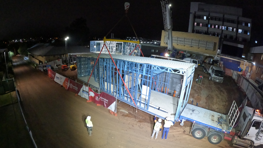 Crane lowering modular building at Toowoomba Hospital