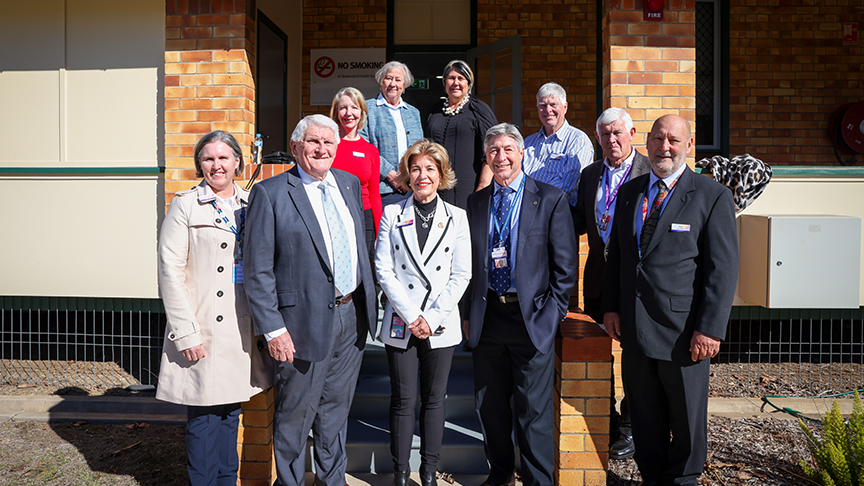 Photo of Darling Downs Health board members standing in front of building in Murgon