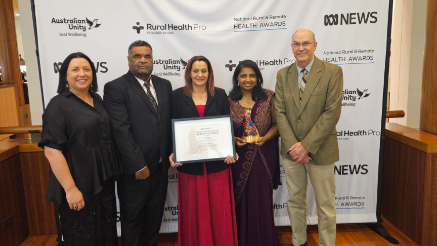 Five staff members standing and displaying their award for Excellence in Aboriginal and Torres Strait Islander Healthcare