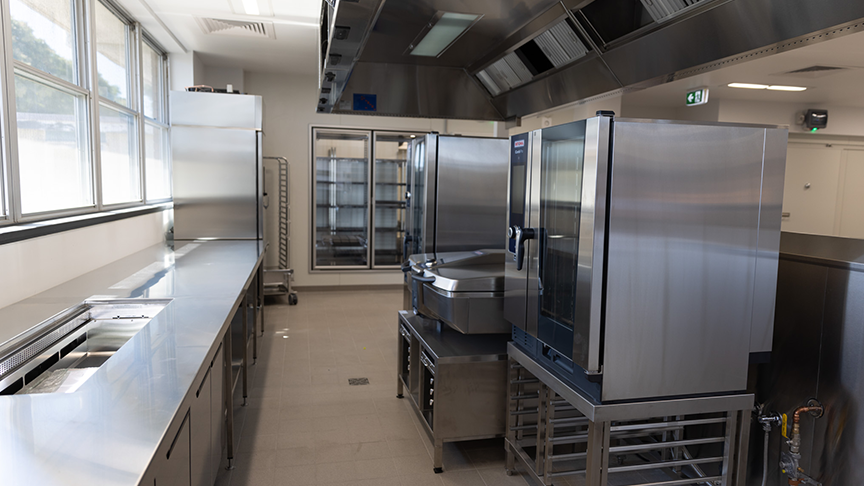 Brand new kitchen equipment in a renovated hospital kitchen.