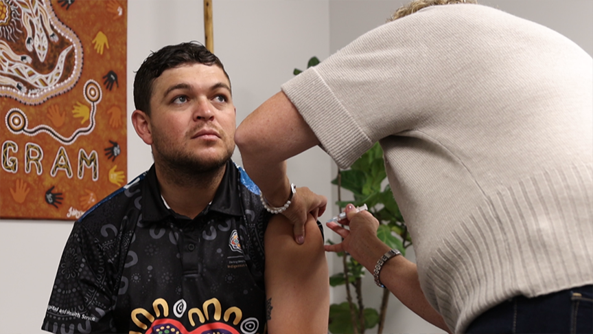 Male receiving flu vaccination