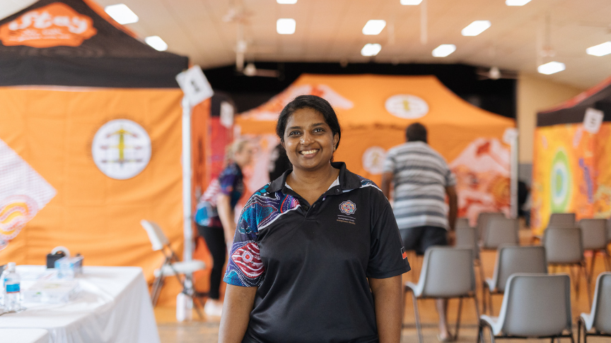 Staff member Dr Priya Janagaraj standing in front of marquees at Healthy Skin clinic