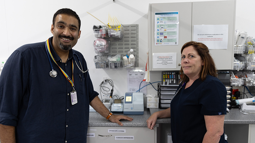 Two healthcare workers standing in front of a bench in the pathology area of Jandowae Hospital